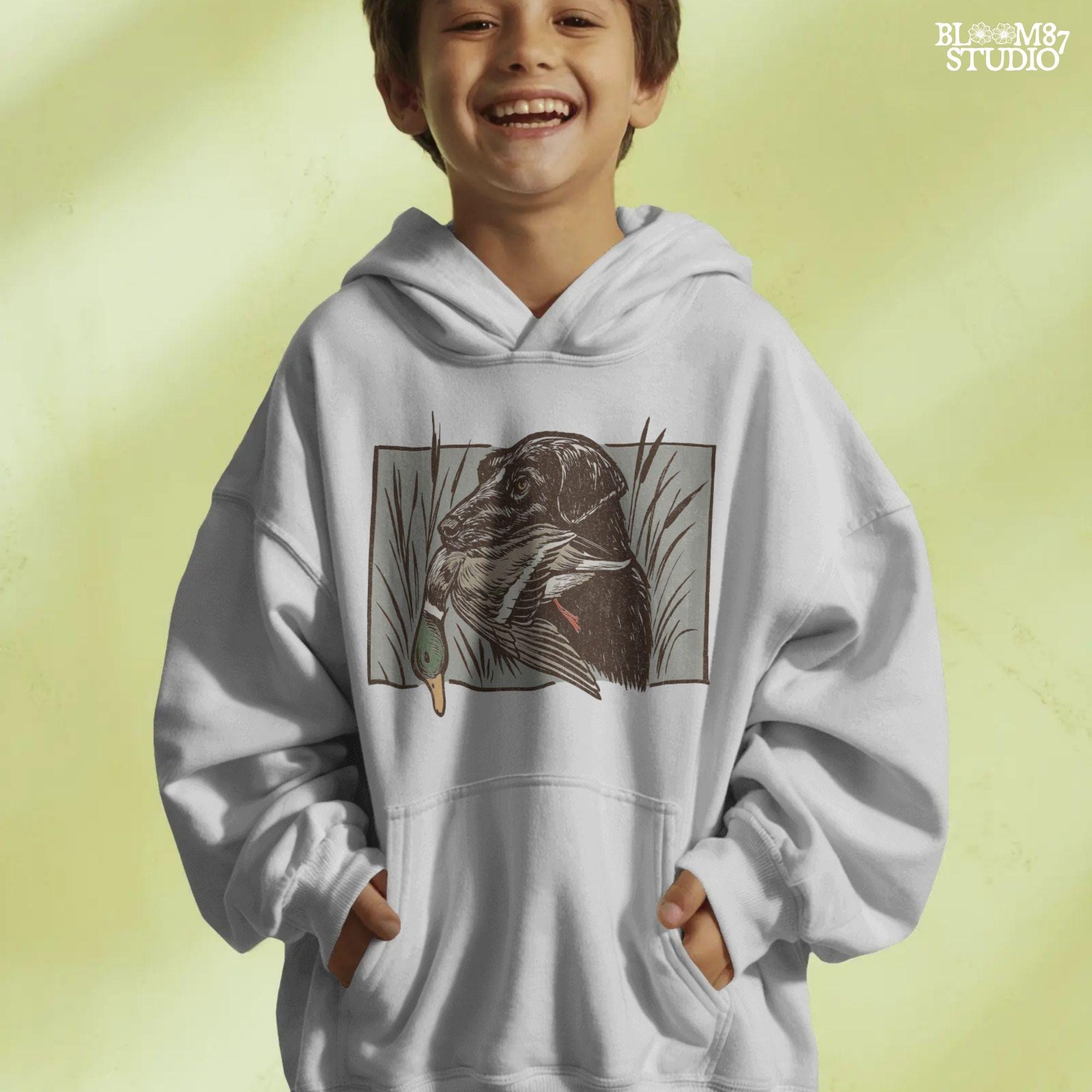 black labrador retriever with mallard duck, duck hunting dog in marsh grass, vintage outdoor hunting design, mallard duck art illustration