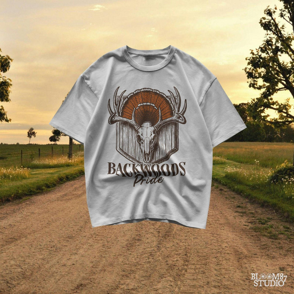 Rustic design of a deer skull with antlers and a turkey fan backdrop above the words “Backwoods Pride,” perfect for country and hunting themes.