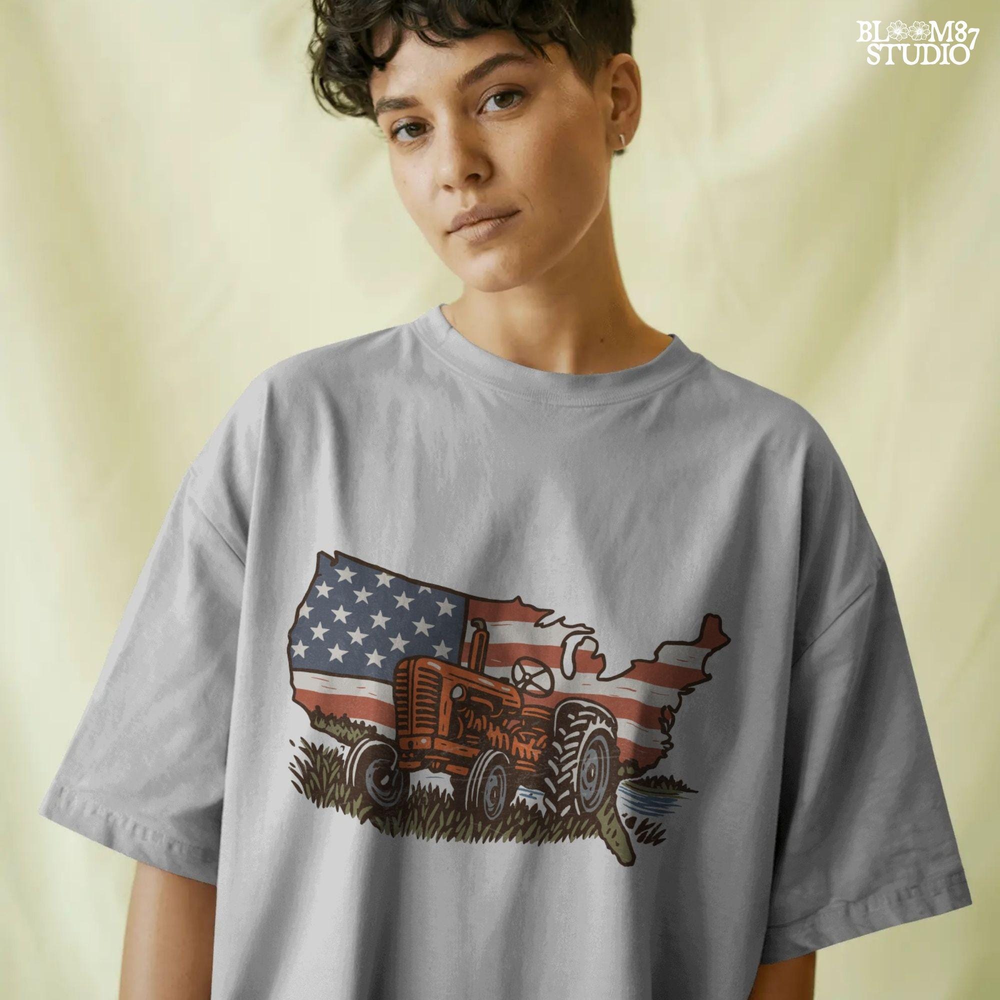 Rustic orange tractor in front of USA map with American flag overlay, vintage patriotic summer farm PNG design.