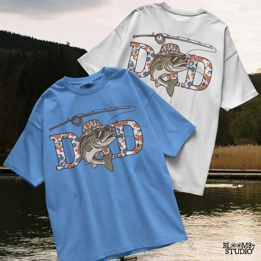 A cool bass fish wearing sunglasses and a bucket hat over red white and blue camo letters spelling DAD, with a fishing rod above.