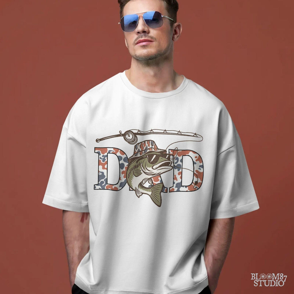 A cool bass fish wearing sunglasses and a bucket hat over red white and blue camo letters spelling DAD, with a fishing rod above.