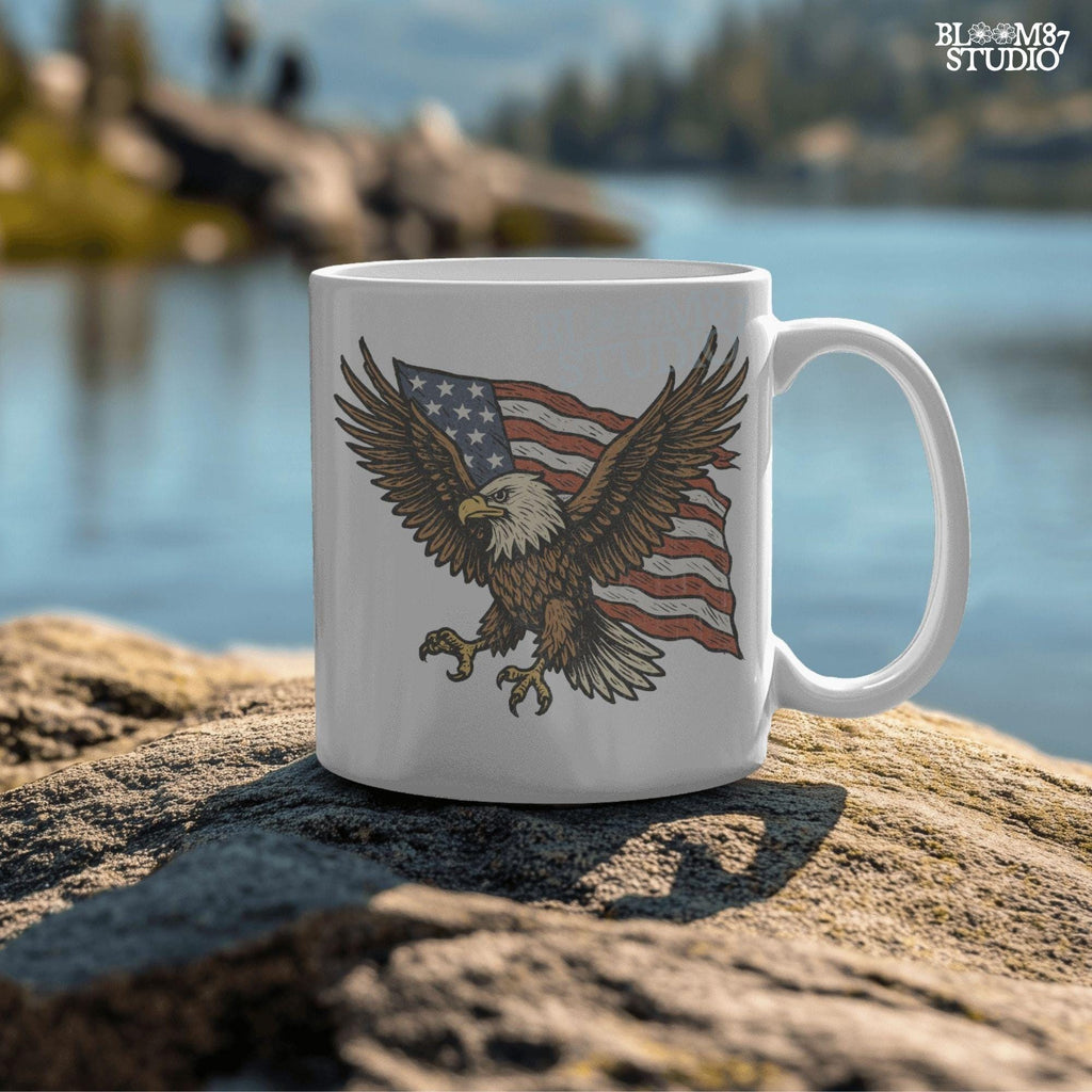 Fierce bald eagle flying with wings spread wide in front of a waving American flag, illustrated in vintage patriotic style.