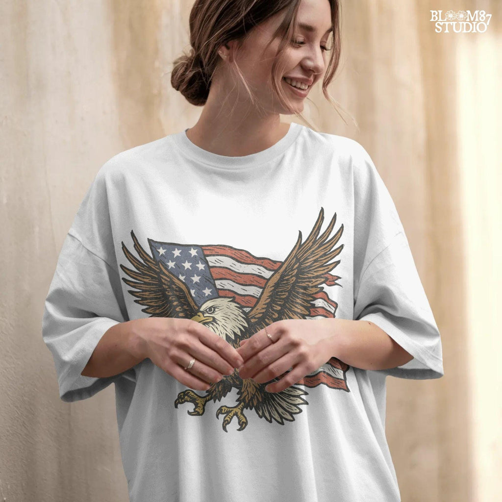 Fierce bald eagle flying with wings spread wide in front of a waving American flag, illustrated in vintage patriotic style.