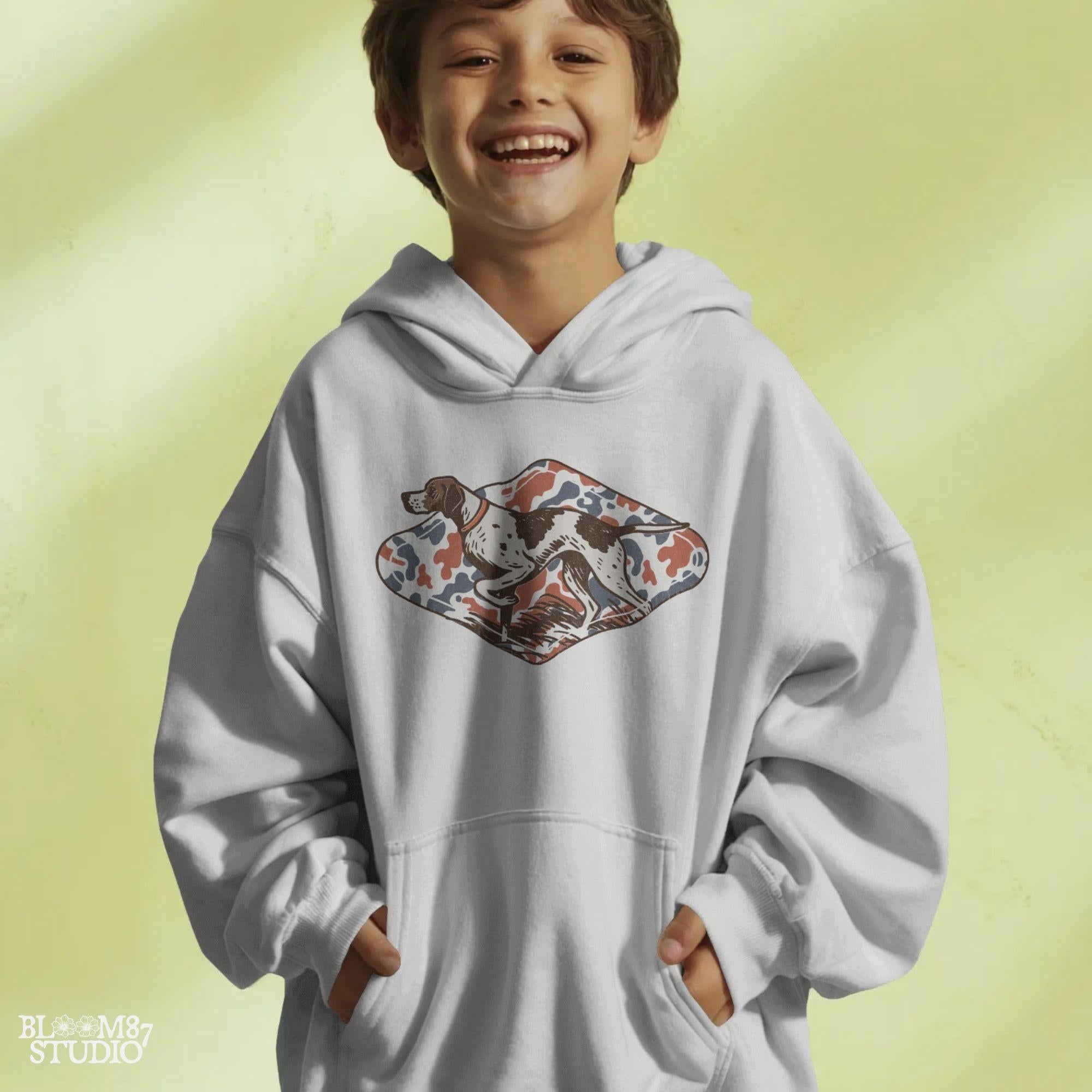 Patriotic illustration of a pointing hunting dog in red, white, and blue camo background, perfect for upland hunting fans and 4th of July projects.