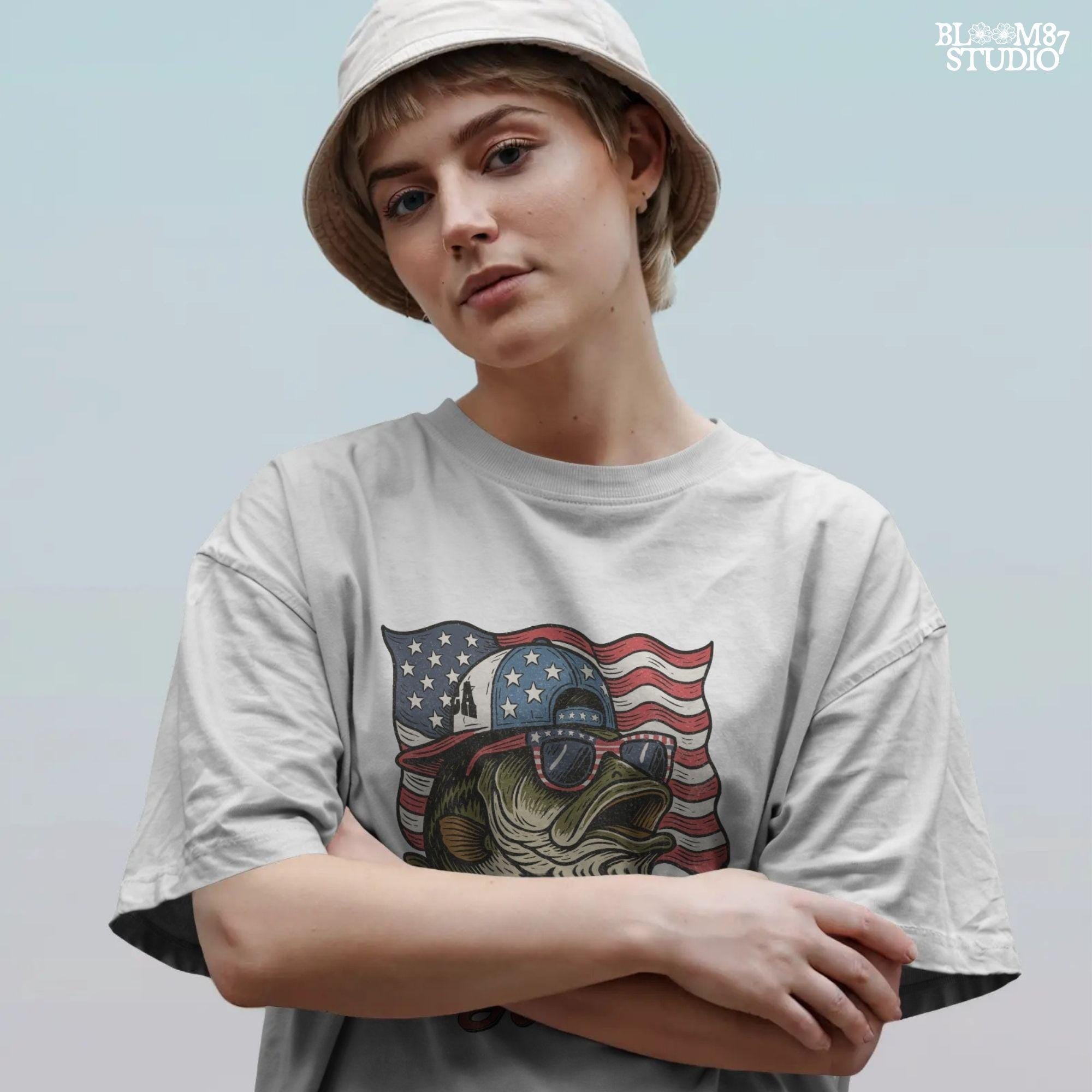 Patriotic cartoon largemouth bass wearing USA sunglasses and a hat in front of the American flag, with the text “American Hooker”.