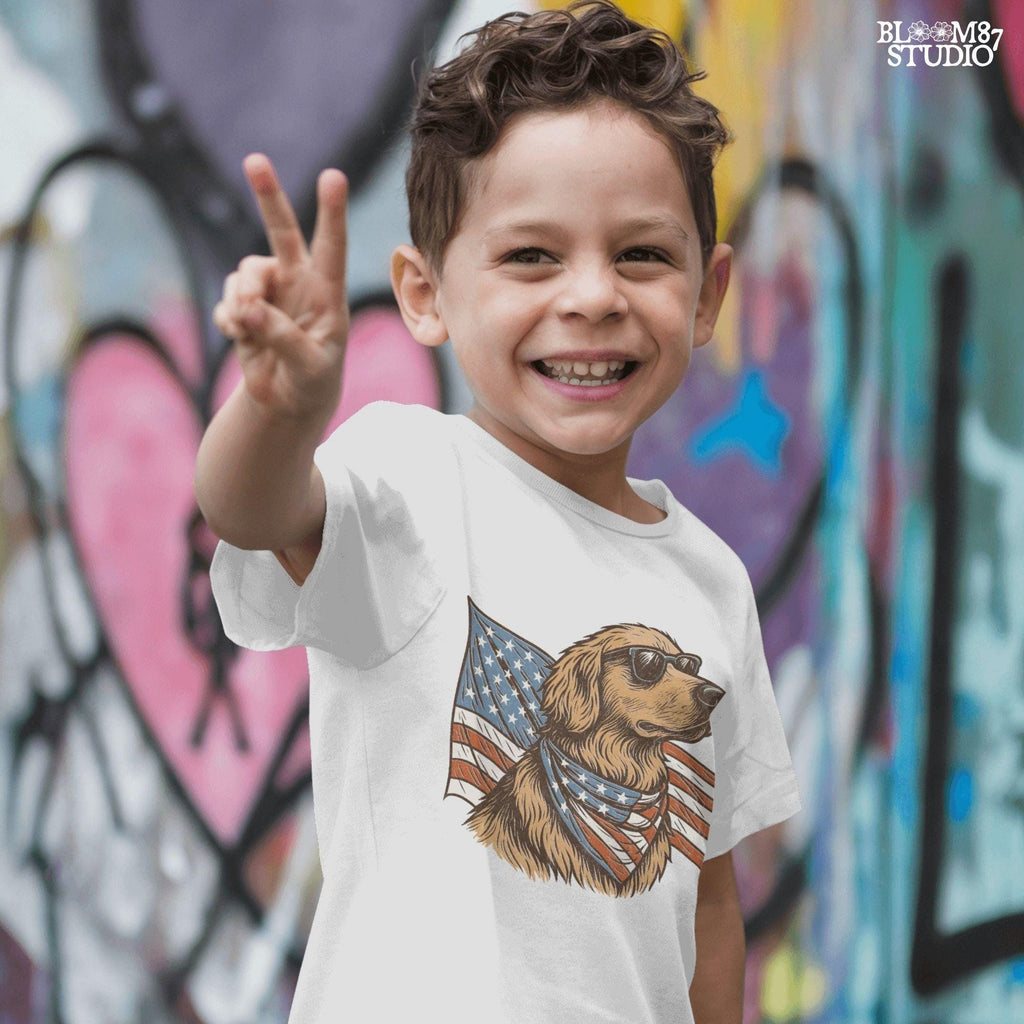 Golden retriever wearing sunglasses and American flag bandana with patriotic cape flowing behind in red, white, and blue design.