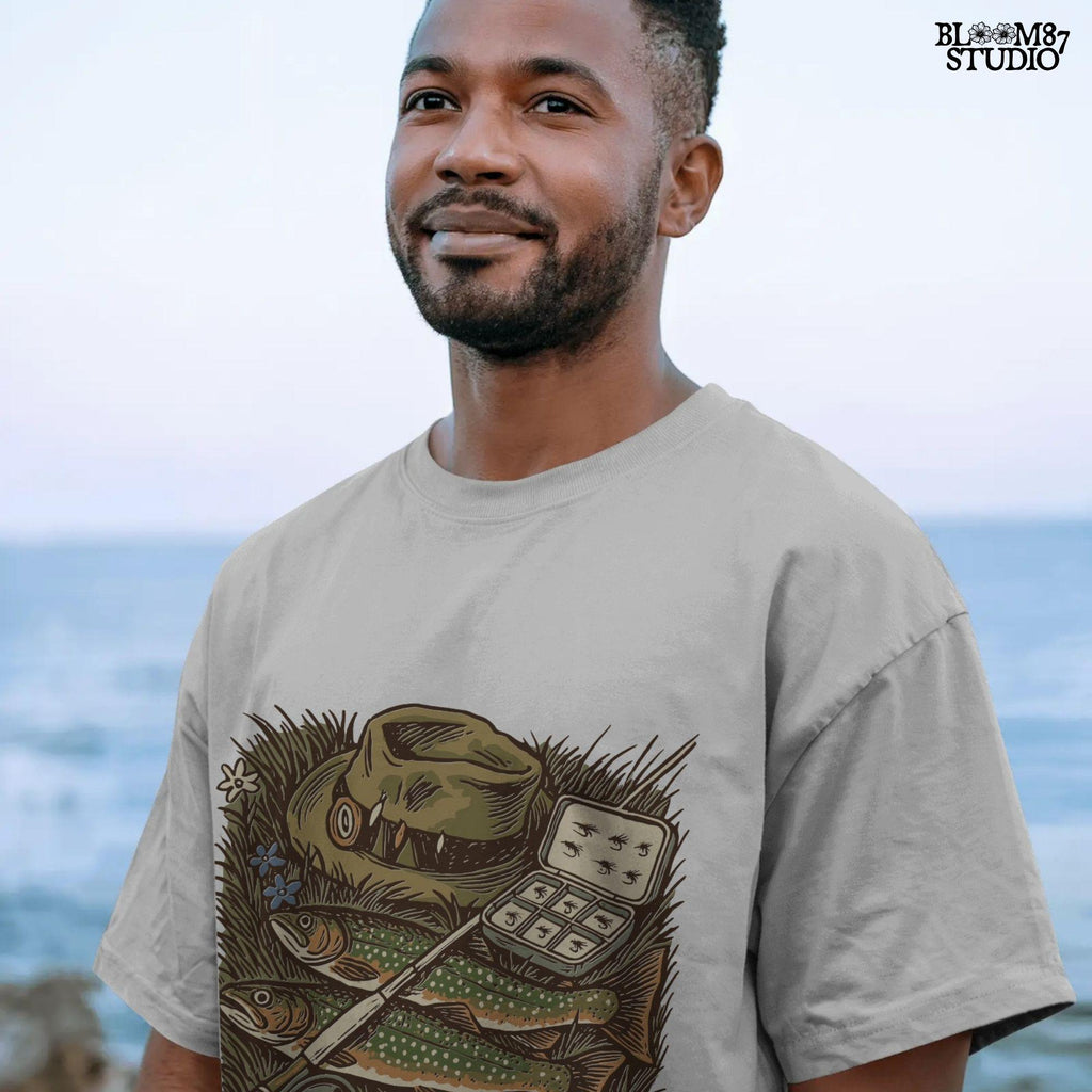 Vintage fly fishing illustration showing two trout, a fly rod, fisherman’s hat, and fly box on grassy ground with wildflowers.