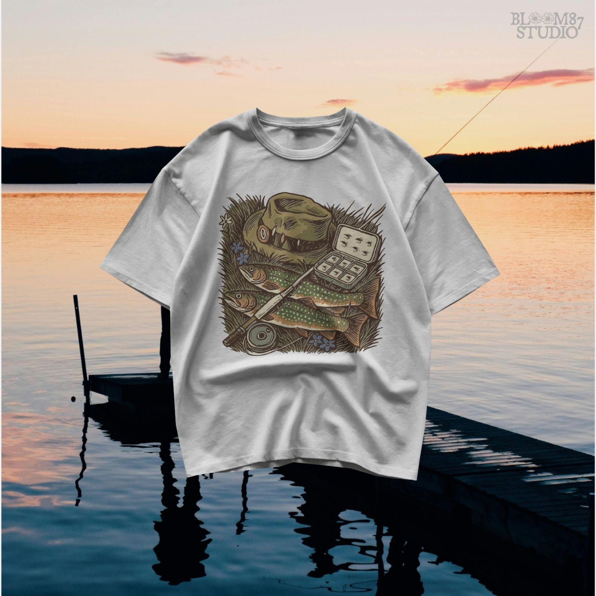 Vintage fly fishing illustration showing two trout, a fly rod, fisherman’s hat, and fly box on grassy ground with wildflowers.