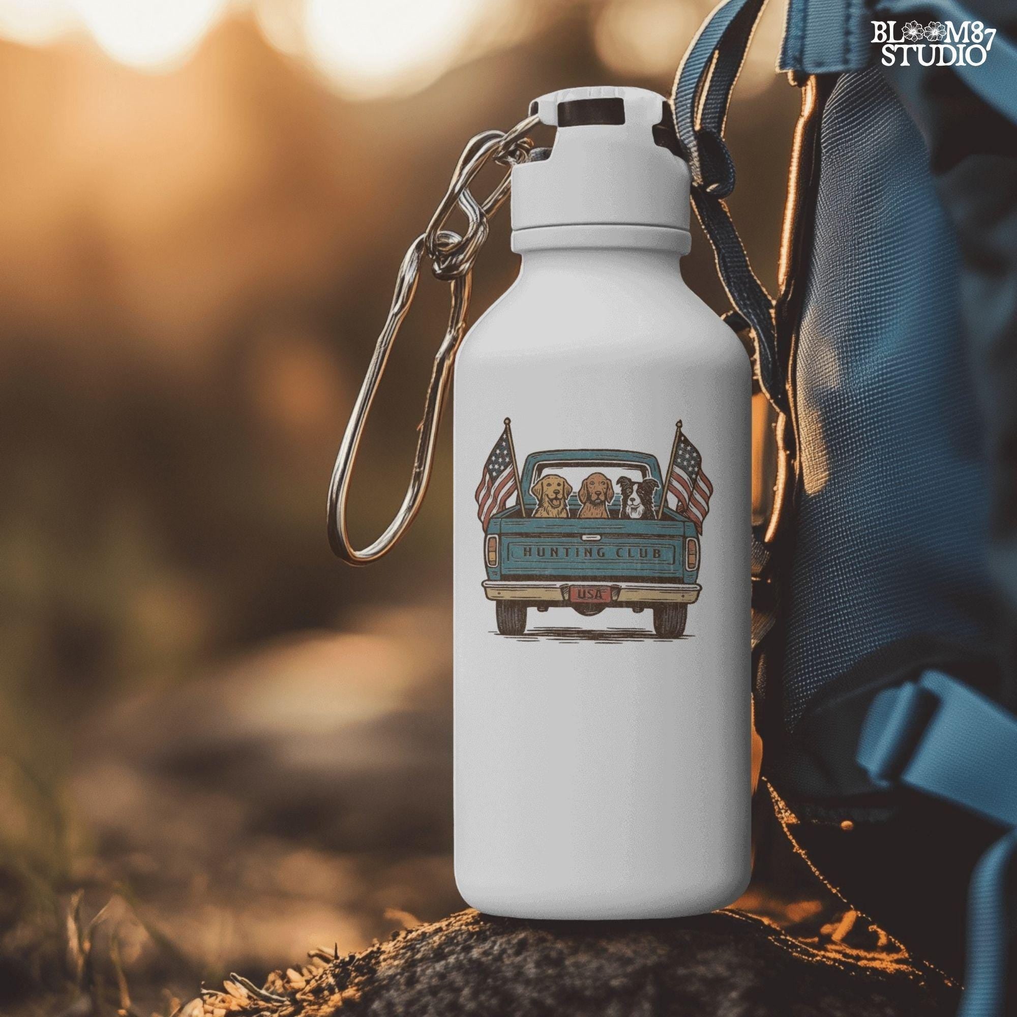 Three hunting dogs in the back of a blue vintage pickup truck with USA flags and “Hunting Club” text, patriotic hunting design for dog lovers.