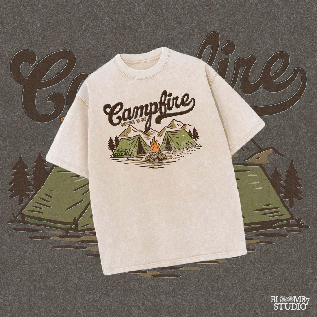Vintage-style illustration of two camping tents, a lit campfire, pine trees, and mountains with the text “Campfire Social Club.”