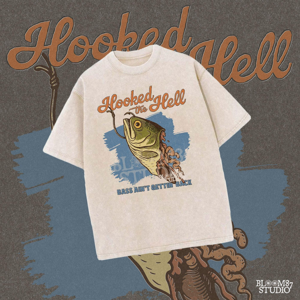 Funny exaggerated bass fish graphic with a hook through its mouth and dramatic detailing, paired with the text “Hooked the Hell” and “Bass Ain’t Gettin Back.”