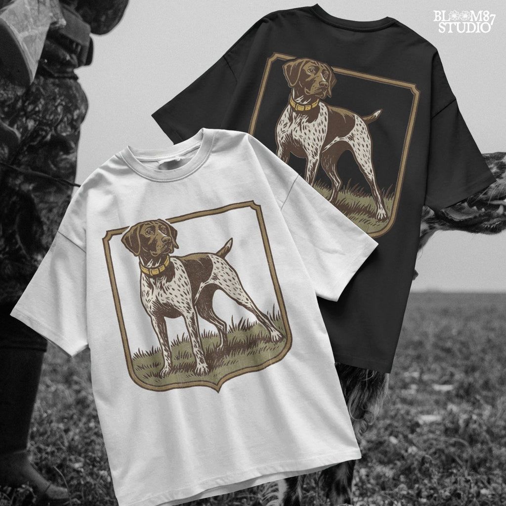 Vintage illustration of a German Shorthaired Pointer standing in grass with a framed border – rustic hunting dog PNG for sublimation.