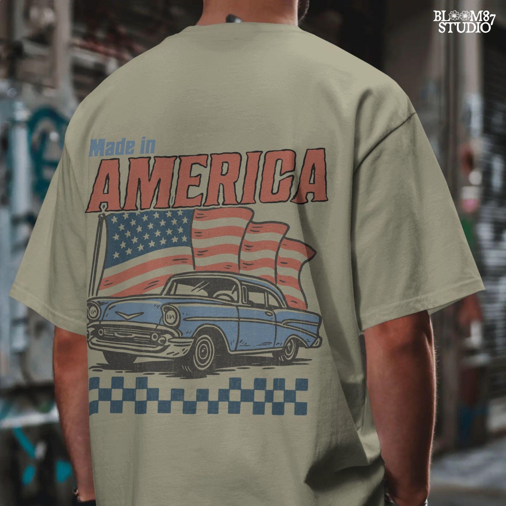 Classic American vintage car driving in front of three waving USA flags with “Made in America” text in bold retro style.