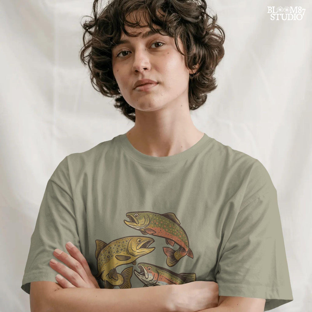 Illustration of rainbow trout, brook trout, and brown trout in colorful, vintage-style drawing with open mouths and detailed markings.