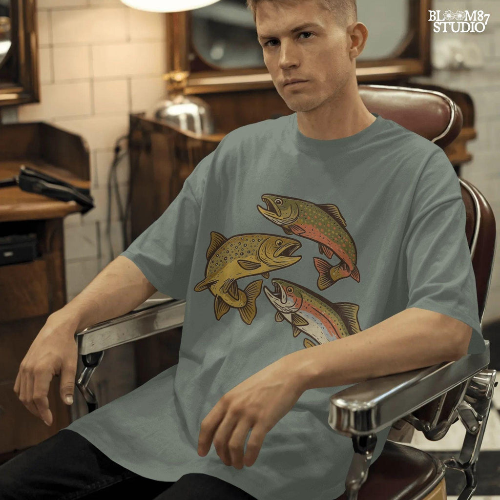 Illustration of rainbow trout, brook trout, and brown trout in colorful, vintage-style drawing with open mouths and detailed markings.