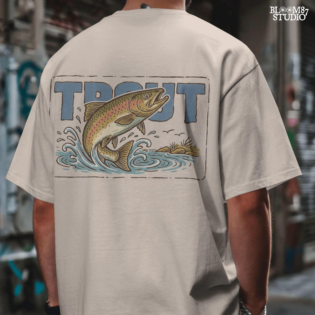 Vintage-style illustration of a rainbow trout jumping from the water in front of bold block letters spelling “TROUT”.
