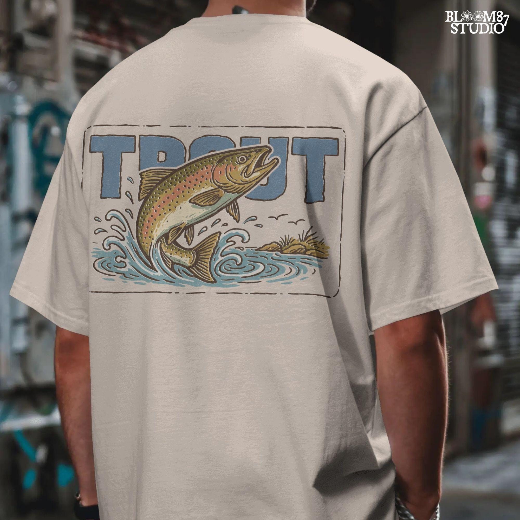 Vintage-style illustration of a rainbow trout jumping from the water in front of bold block letters spelling “TROUT”.