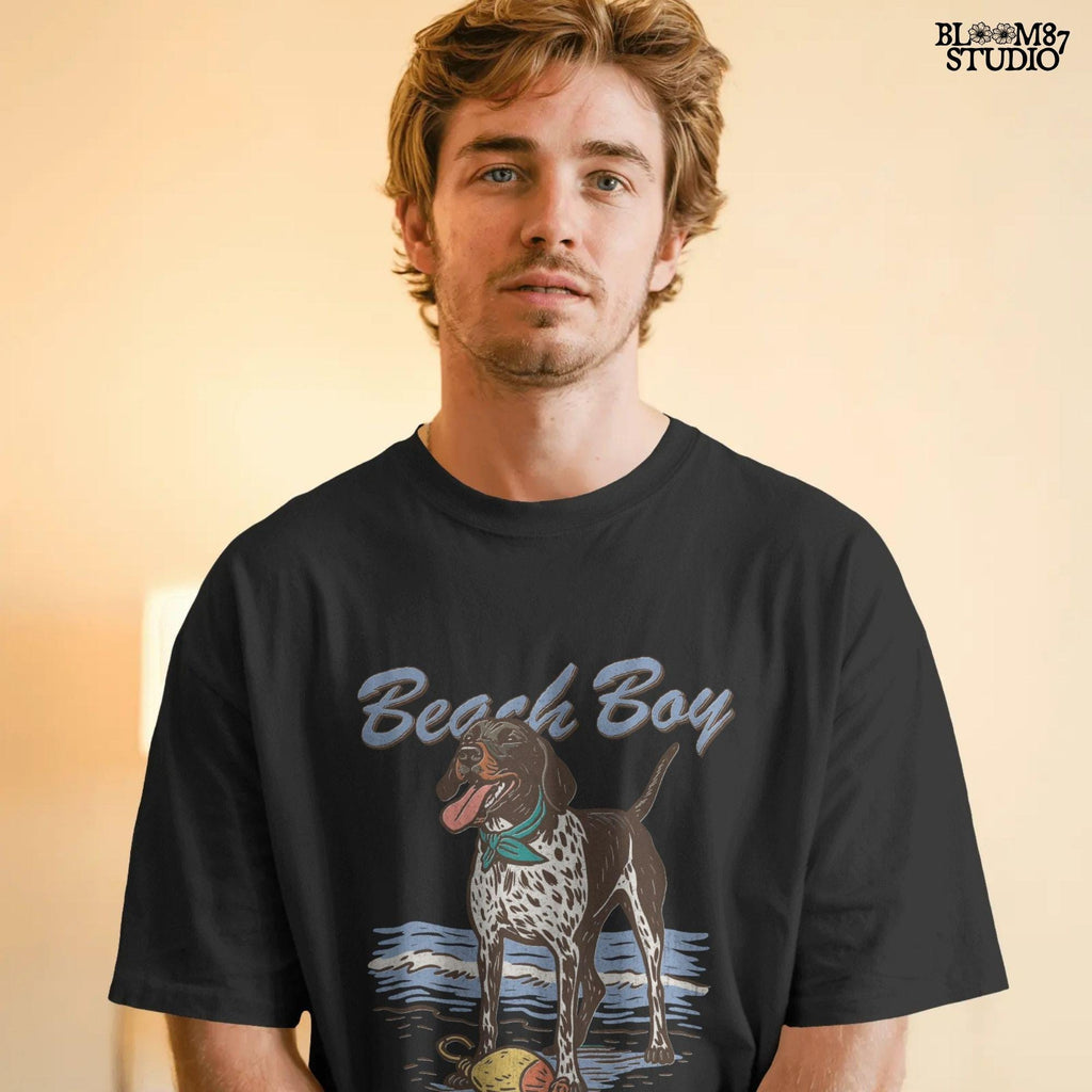 Vintage-style German Shorthaired Pointer standing on the beach with a buoy toy, text reads “Beach Boy – Raised on Waves and Whistles” – summer dog PNG.