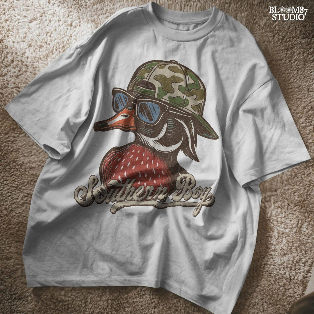 Funny Southern-style duck wearing a camo cap and sunglasses, text reads “Southern Boy” – sublimation PNG for hunting or country-themed apparel.