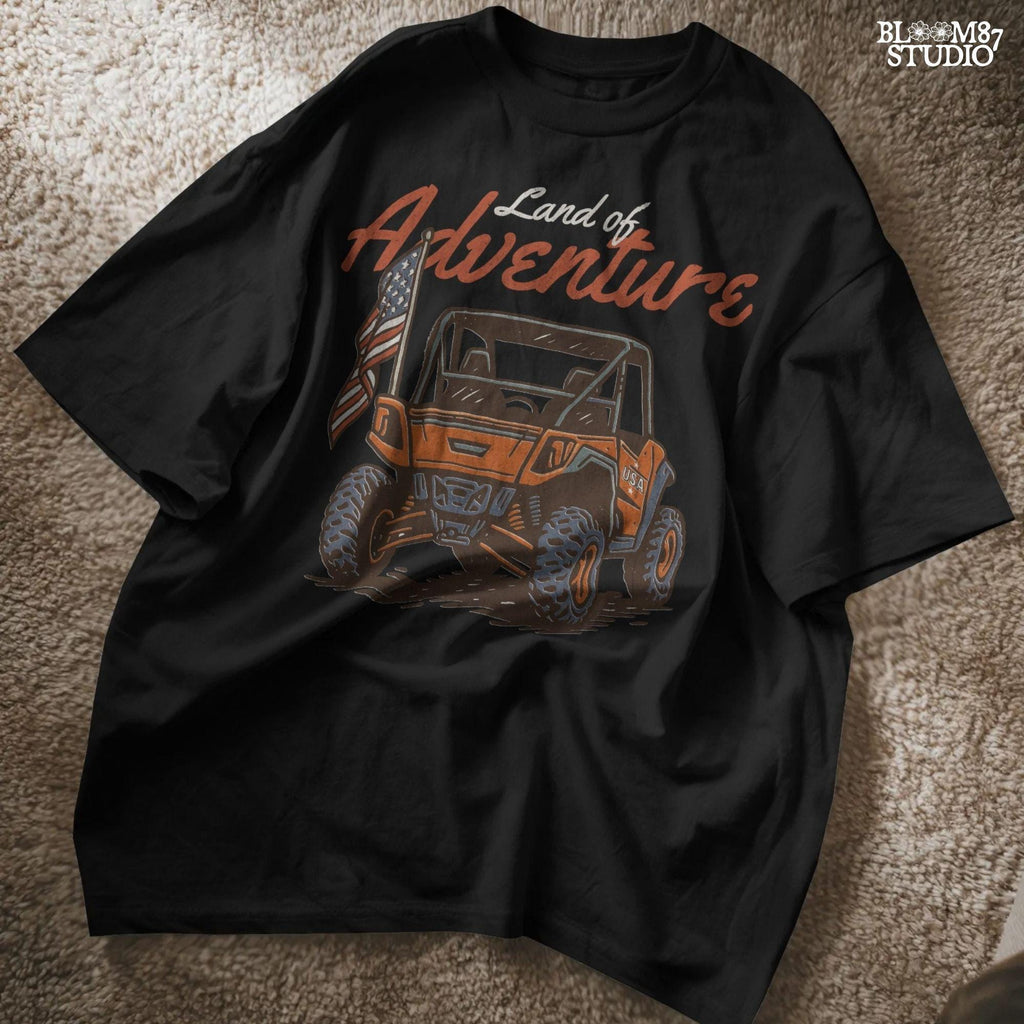 Off-road UTV with American flag driving on a dirt trail, text reads “Land of Adventure” – patriotic outdoor sublimation PNG design.