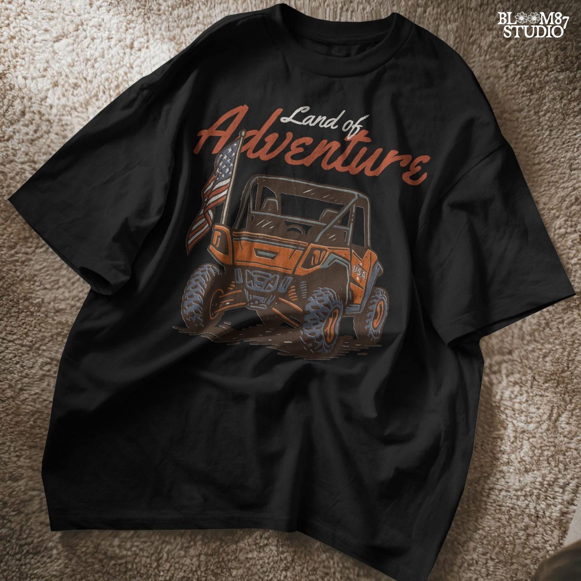 Off-road UTV with American flag driving on a dirt trail, text reads “Land of Adventure” – patriotic outdoor sublimation PNG design.