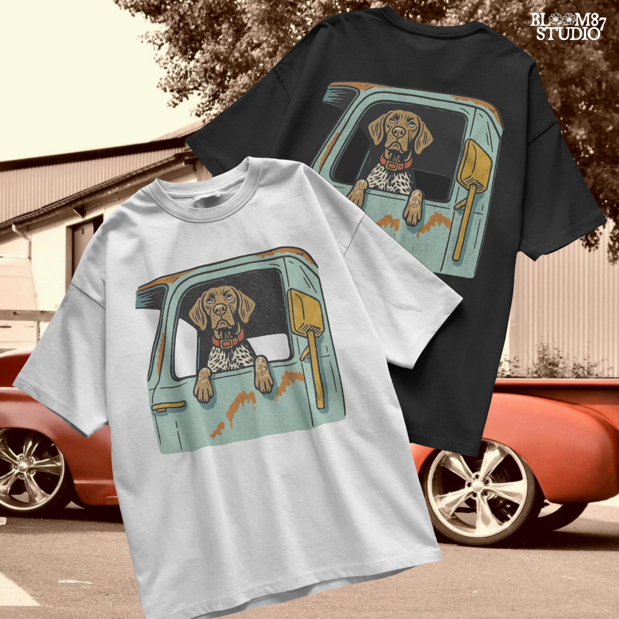 Vintage-style German Shorthaired Pointer with front paws out an old farm truck window – rustic hunting dog sublimation PNG.