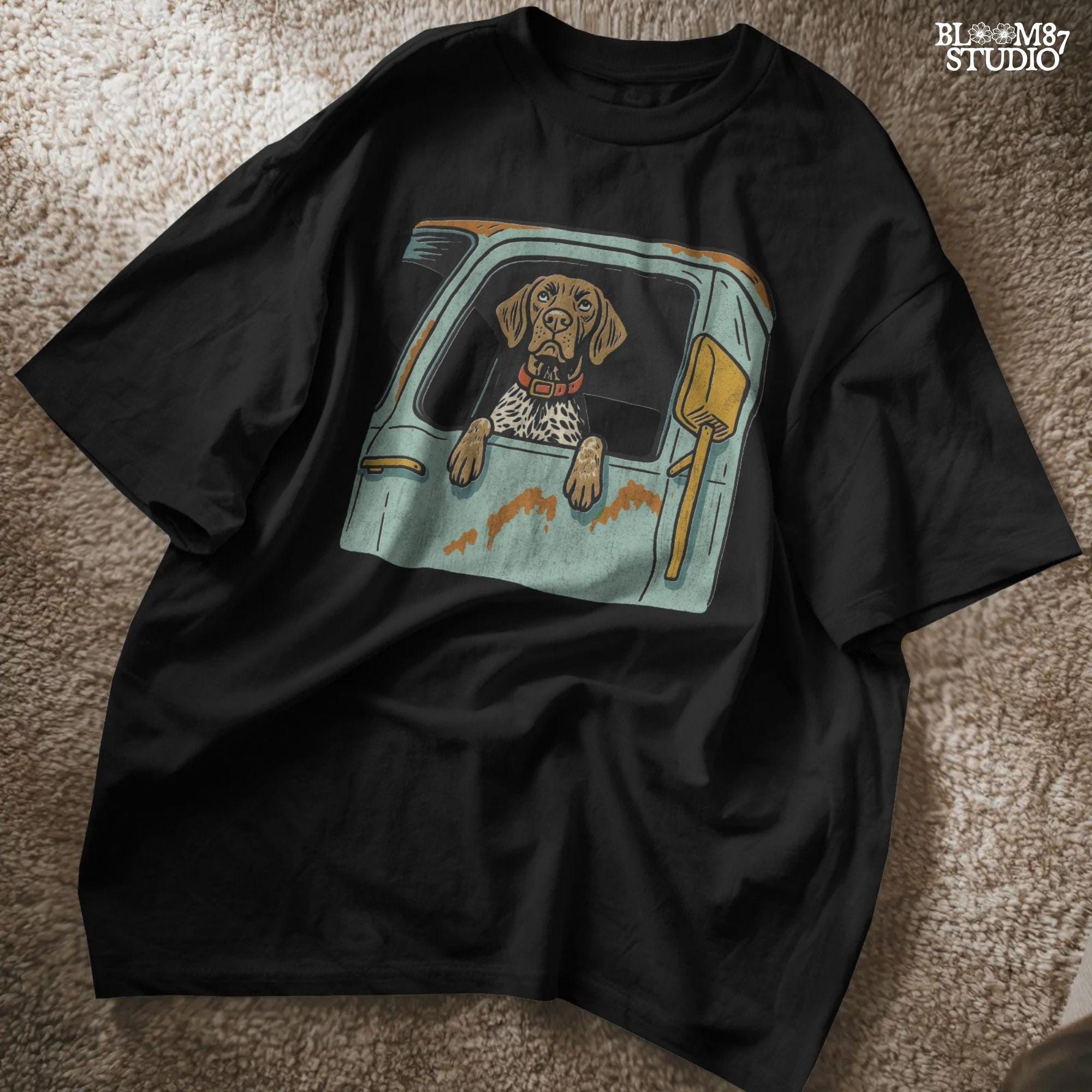 Vintage-style German Shorthaired Pointer with front paws out an old farm truck window – rustic hunting dog sublimation PNG.