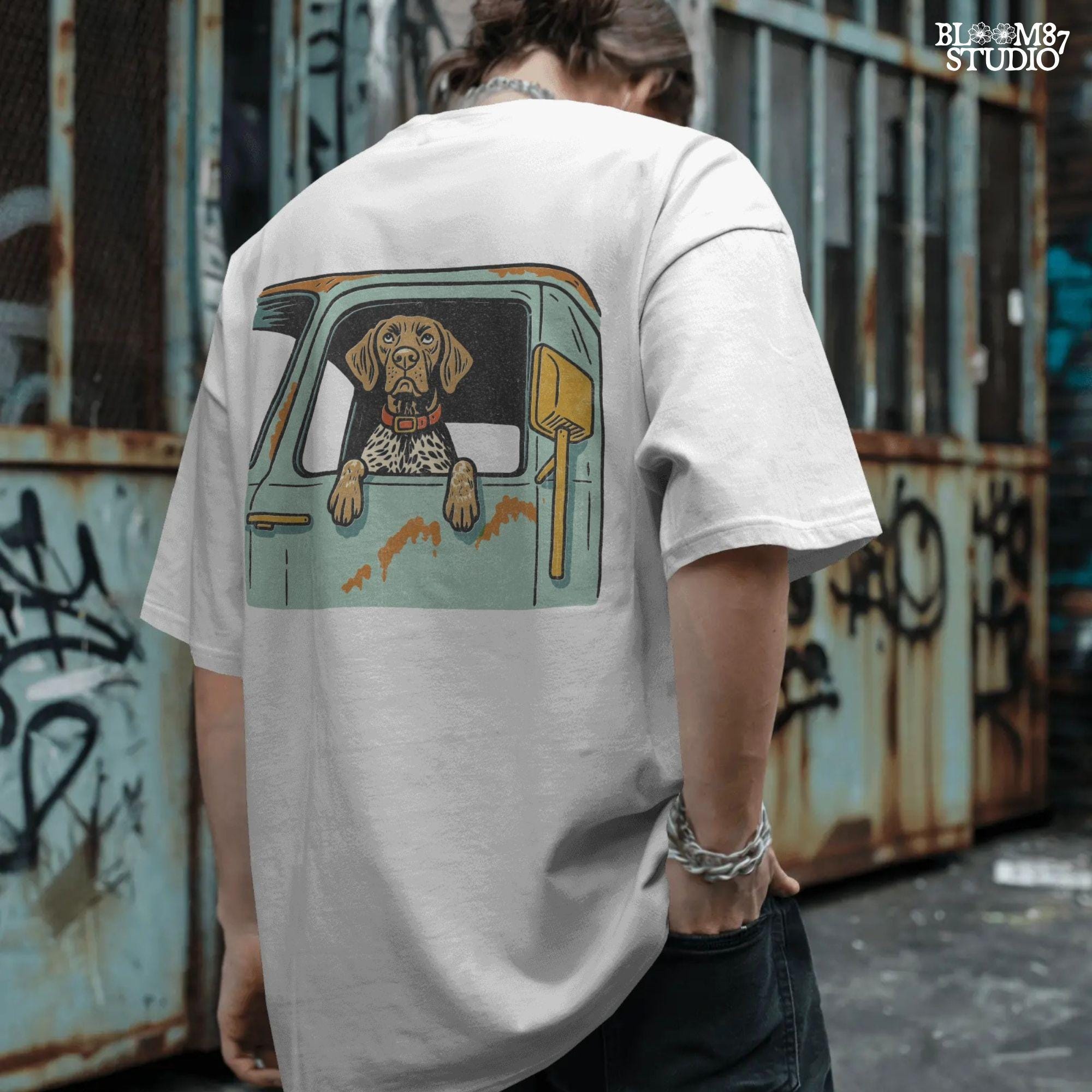 Vintage-style German Shorthaired Pointer with front paws out an old farm truck window – rustic hunting dog sublimation PNG.