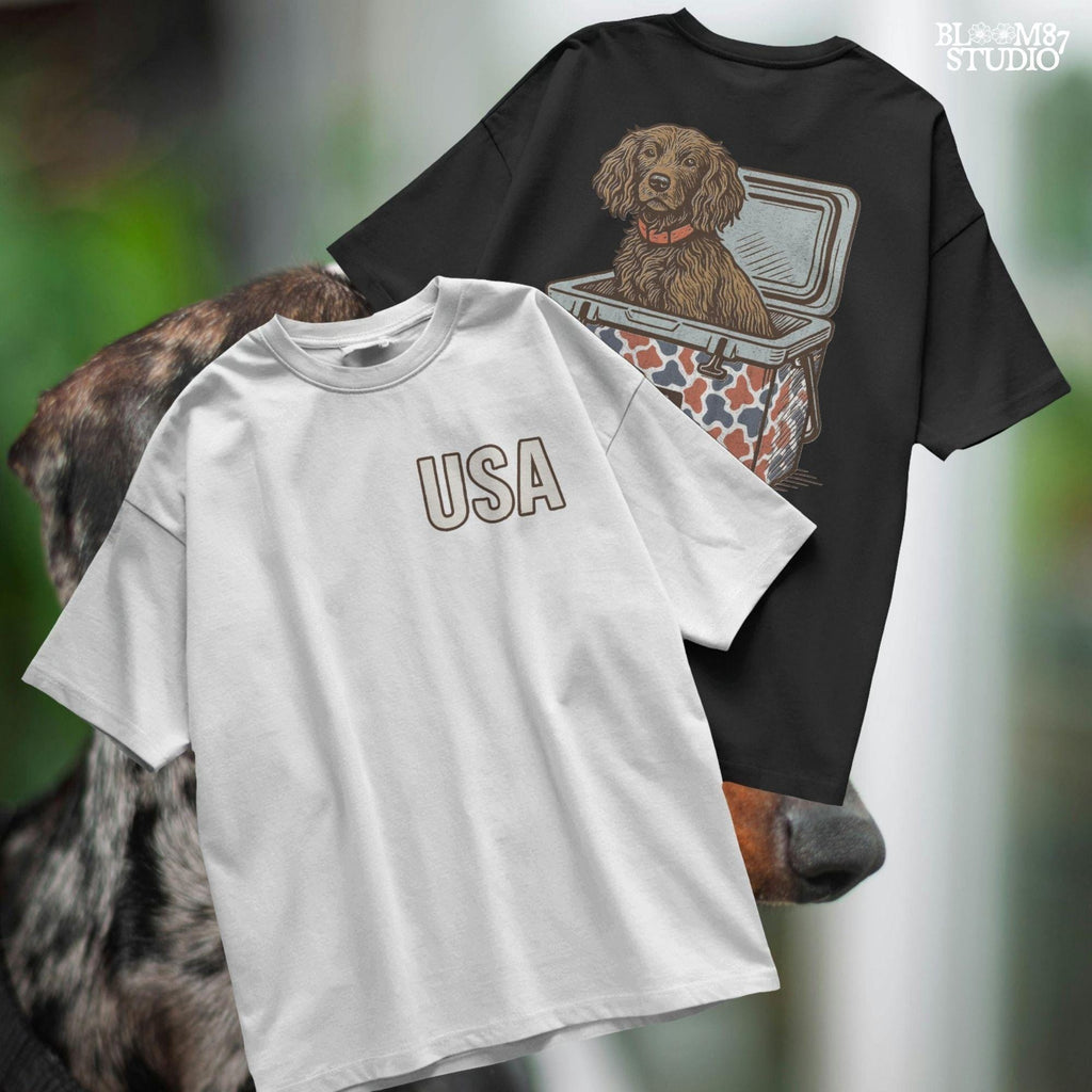 Sporting dog (spaniel type) sitting in a patriotic red-white-blue camo cooler labeled “USA” – sublimation PNG for southern dog lovers and summer crafts.