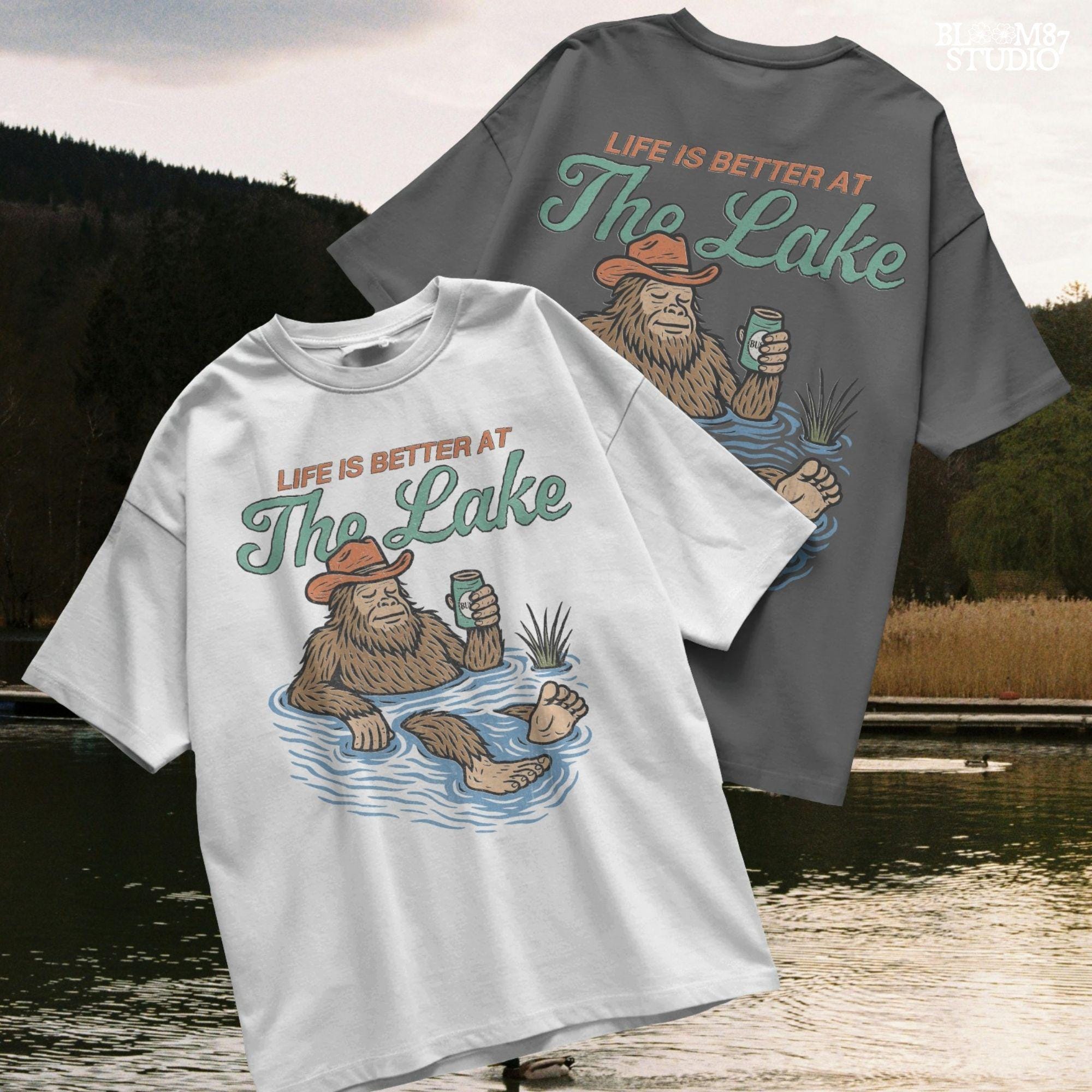 Cartoon Bigfoot relaxing in a lake wearing a cowboy hat, holding a beer can, with retro text saying “Life is Better at the Lake”