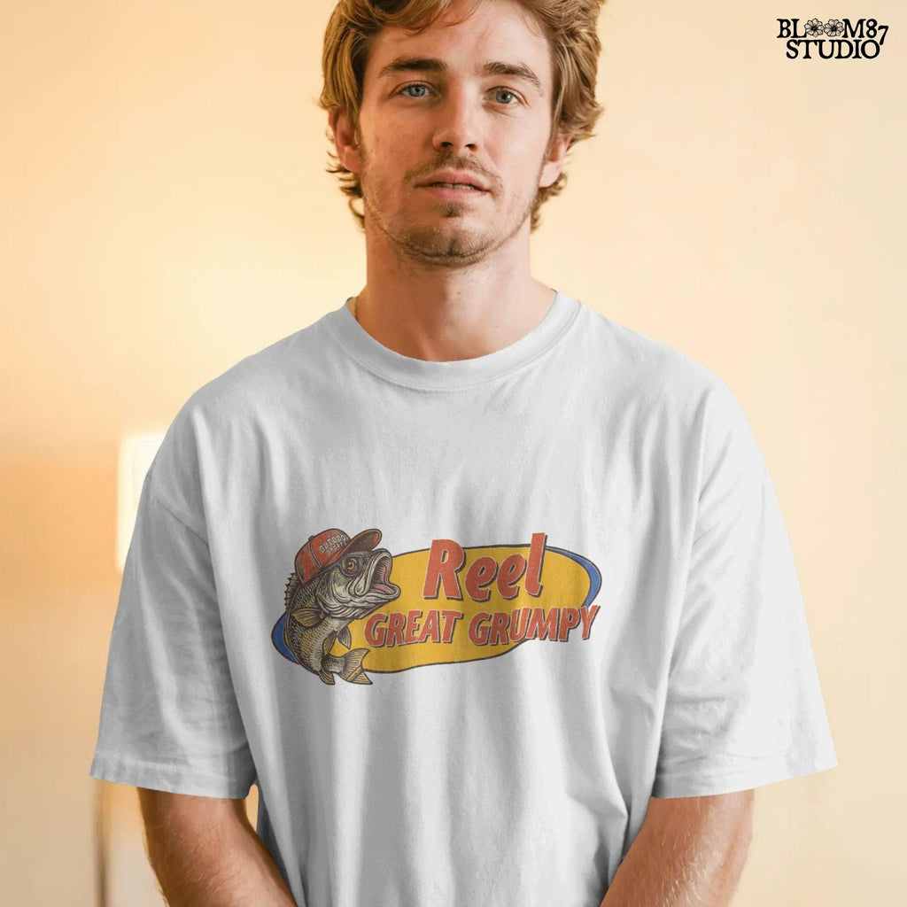 Retro-style grumpy bass fish wearing a red outdoor hat with bold text “Reel Great Grumpy” on a yellow and orange background