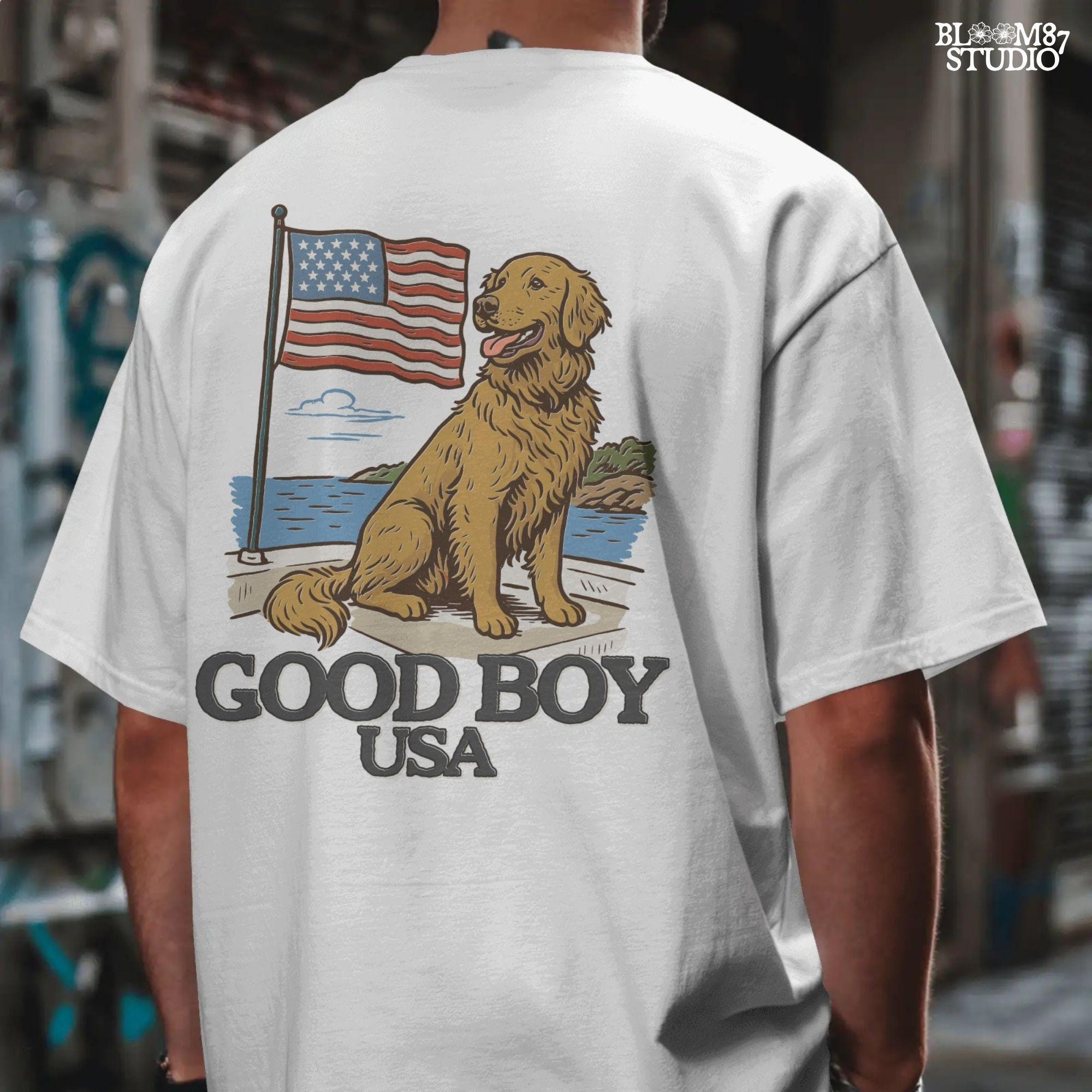 Golden retriever sitting proudly in front of the American flag with “Good Boy USA” text below, patriotic dog design