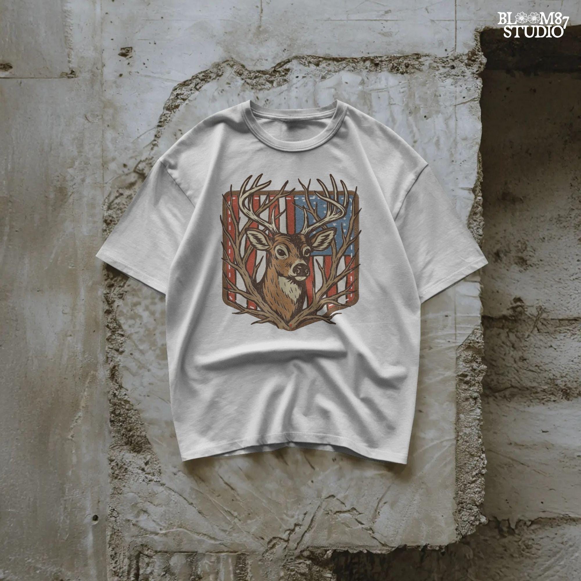 Illustration of a proud buck with large antlers standing in front of a stitched American flag patch, rustic hunting style.