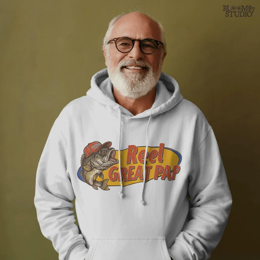 Vintage-style illustration of a largemouth bass in a red hat with retro text “Reel Great Pap” on a yellow and blue background