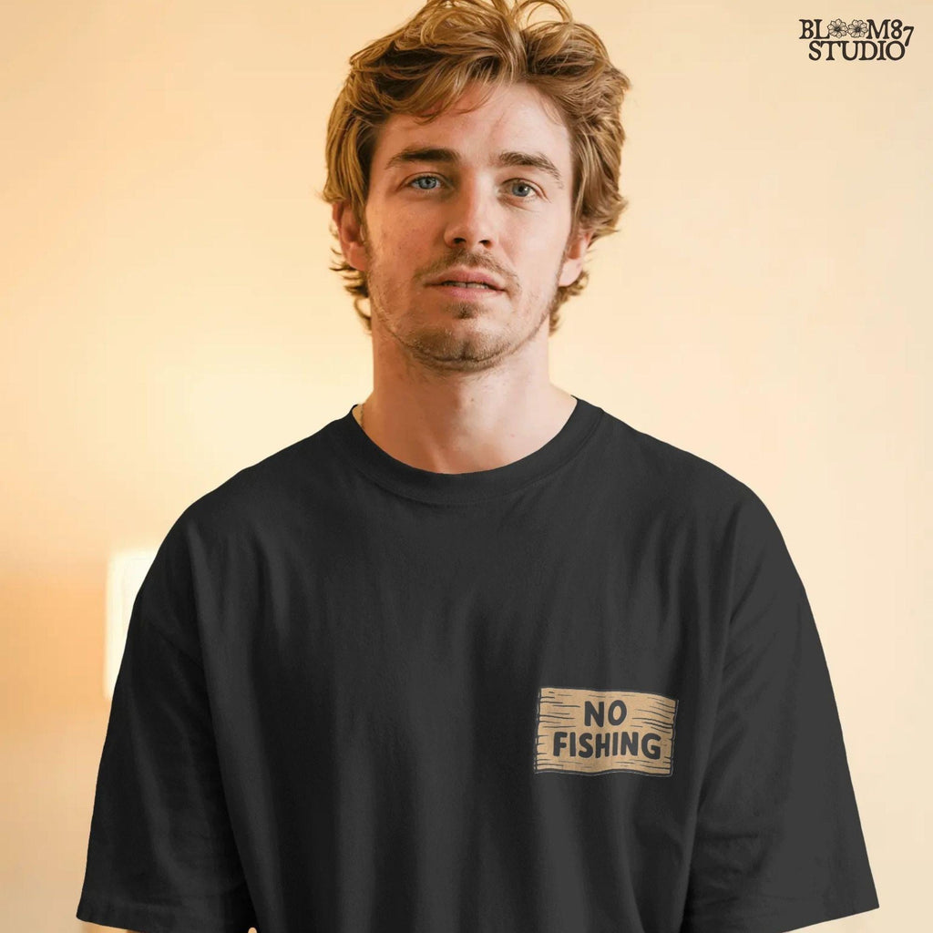 Cartoon kingfisher bird sitting on a tree holding a “No Fishing” sign with a fish hanging below, in a humorous lake life design