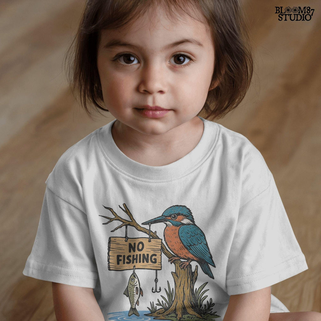 Cartoon kingfisher bird sitting on a tree holding a “No Fishing” sign with a fish hanging below, in a humorous lake life design