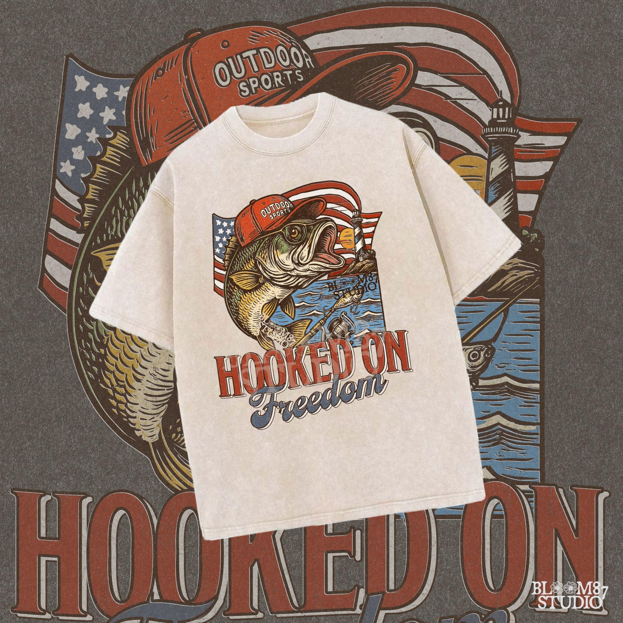Patriotic bass fish wearing red cap with American flag, lighthouse, and “Hooked on Freedom” text – ideal for 4th of July fishing designs.