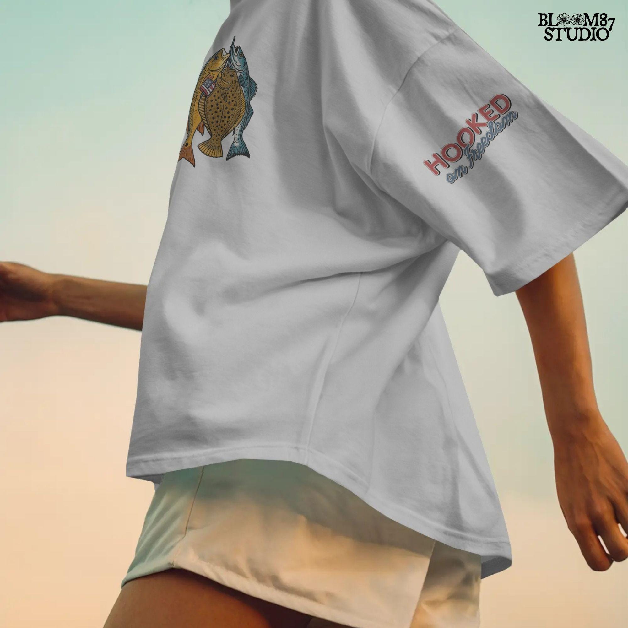 Three saltwater game fish (redfish, flounder, trout) hanging from a line, with a small American flag detail on one fish, in vintage patriotic fishing style