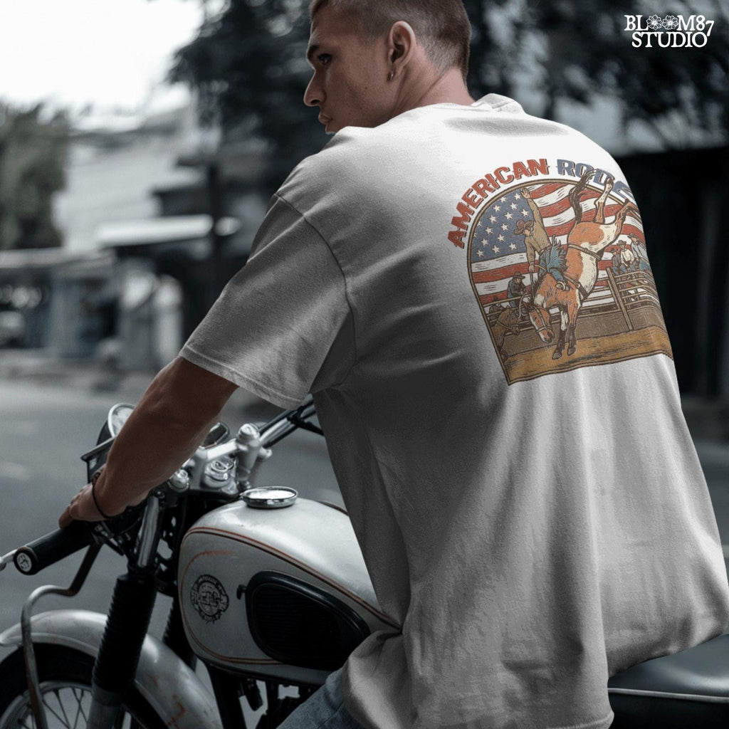 Vintage American rodeo illustration with cowboy riding bucking horse, U.S. flag in background – patriotic Western PNG design.