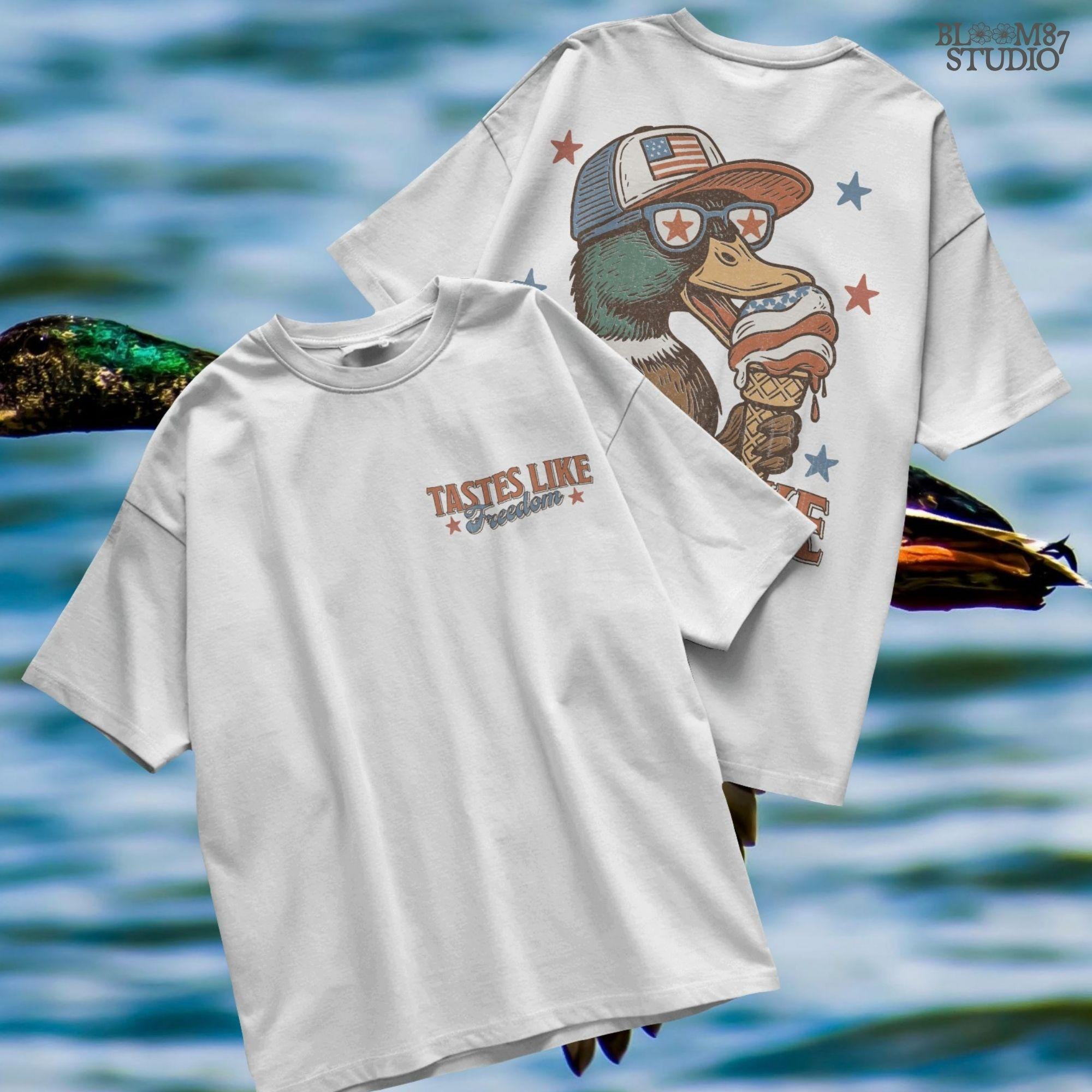 Funny cartoon duck wearing USA hat and star sunglasses, licking patriotic ice cream cone with “Tastes Like Freedom” text and red-white-blue stars