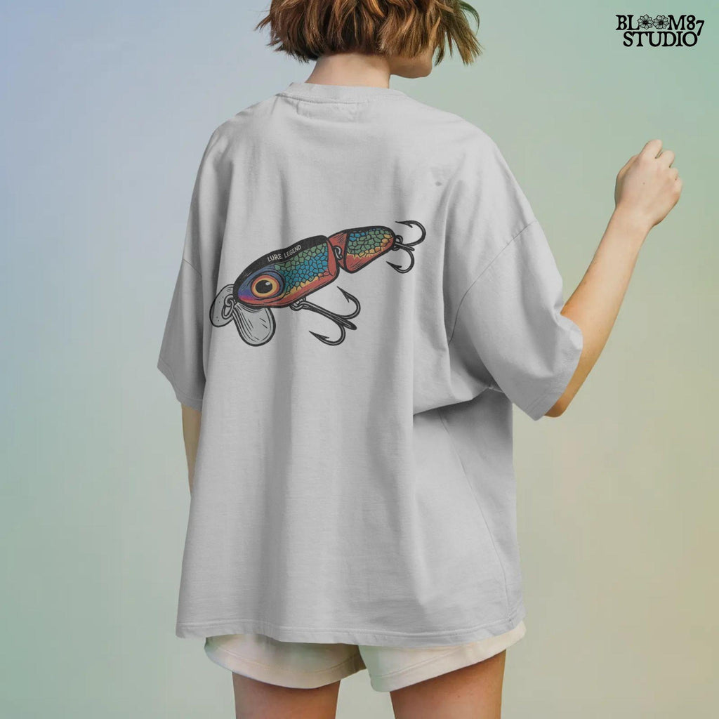 Colorful vintage fishing lure with rainbow scale pattern, metal hooks, and “Lure Legend” text – designed in bold cartoon style