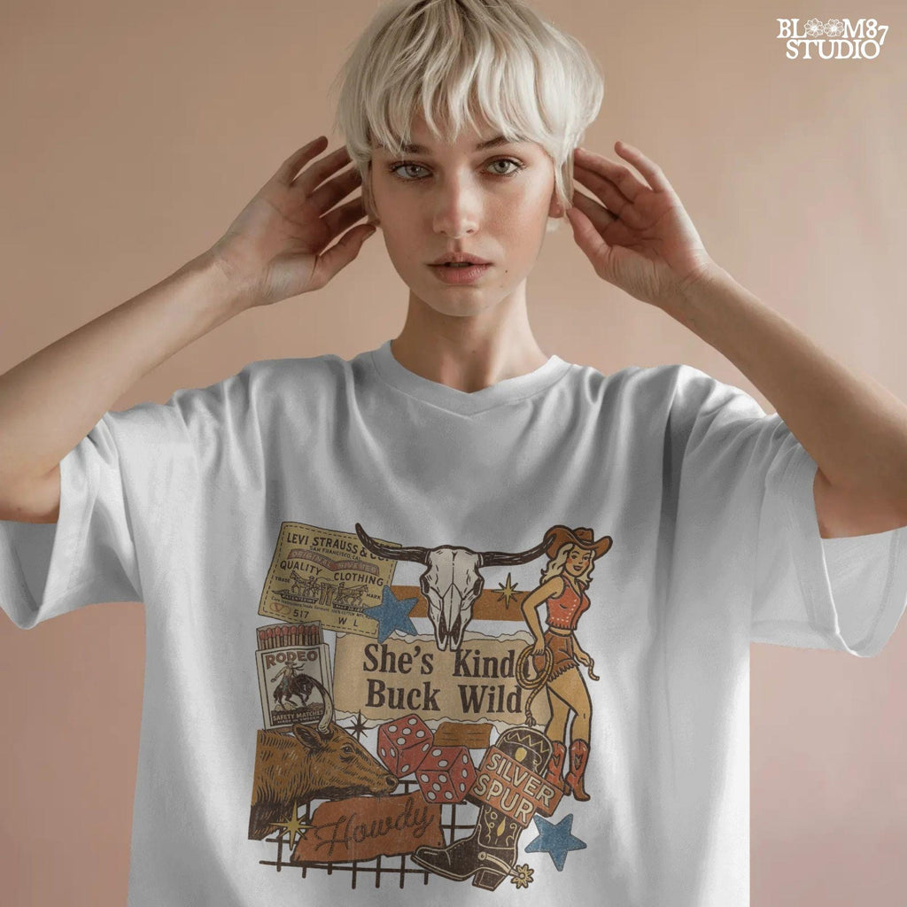 Retro Western howdy collage PNG with cowgirl, skull, dice, boots, bull, and text “She’s Kinda Buck Wild” – vintage rodeo sublimation design.