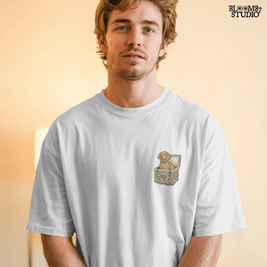 Cute golden retriever dog sitting inside a camouflage cooler with “USA” label, in a rustic patriotic cartoon style