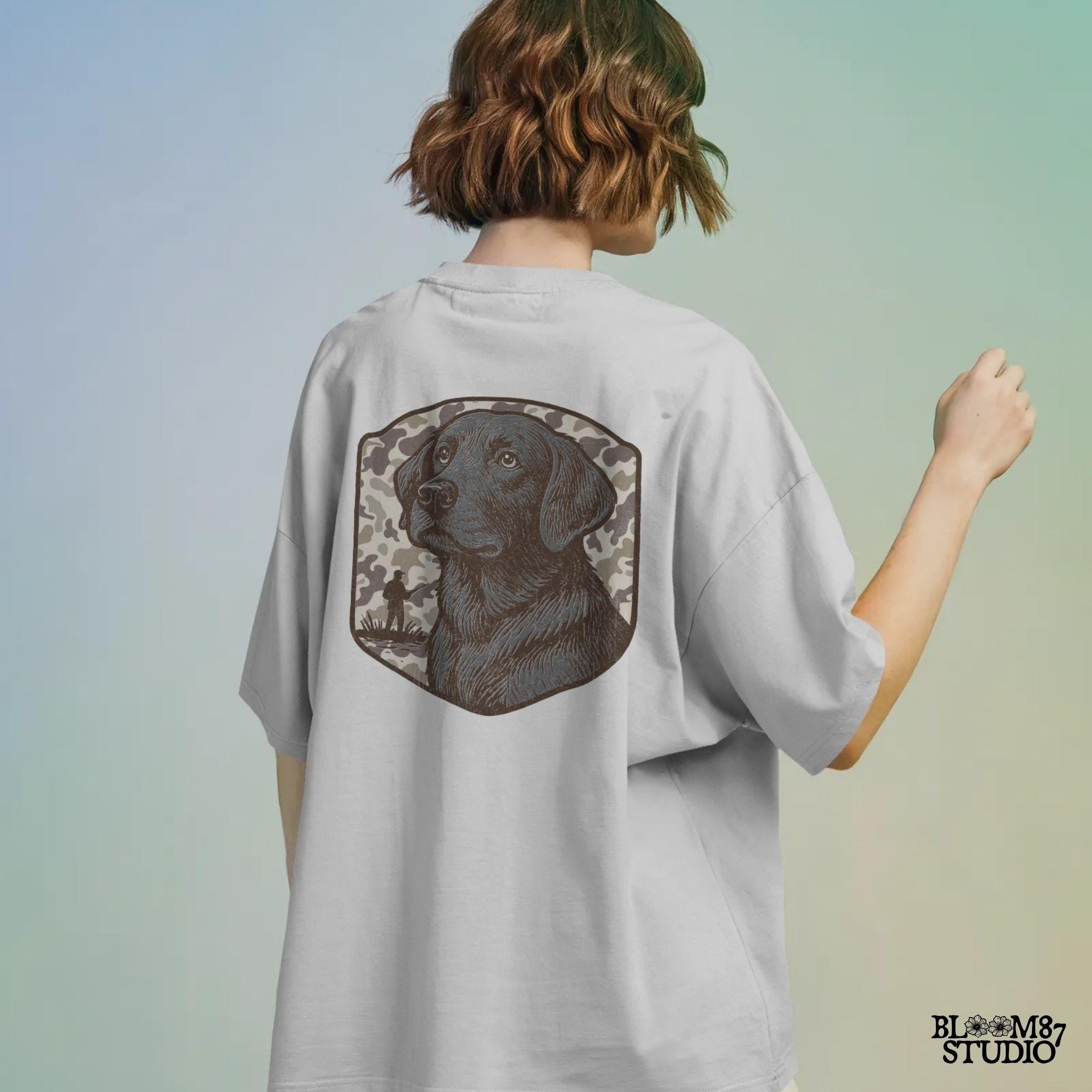 Hand-drawn black Labrador retriever with camo background and duck hunter silhouette – vintage-style sublimation design for outdoor lovers.