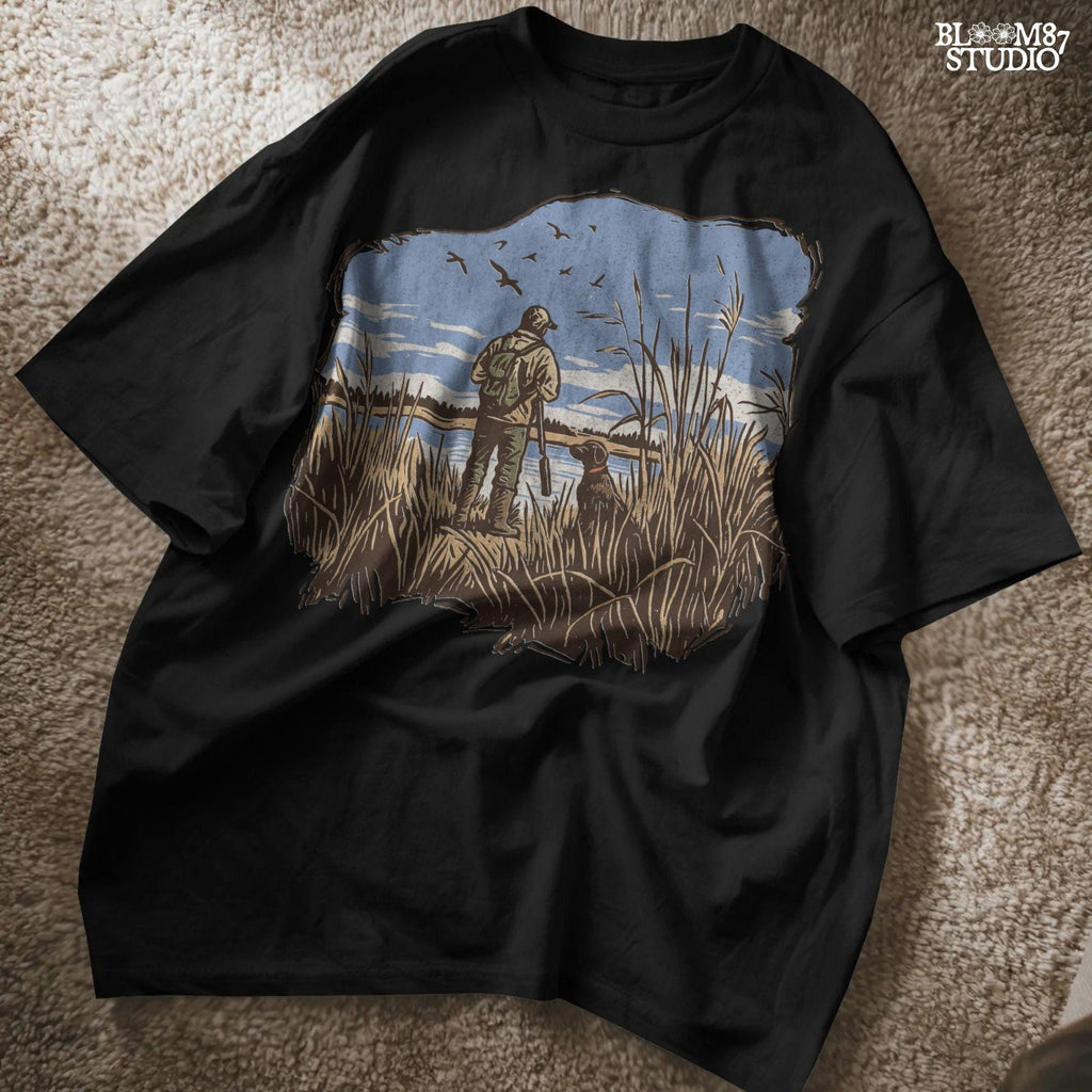Rustic illustration of a duck hunter with shotgun standing beside his dog in a marsh, watching ducks fly overhead under a blue sky