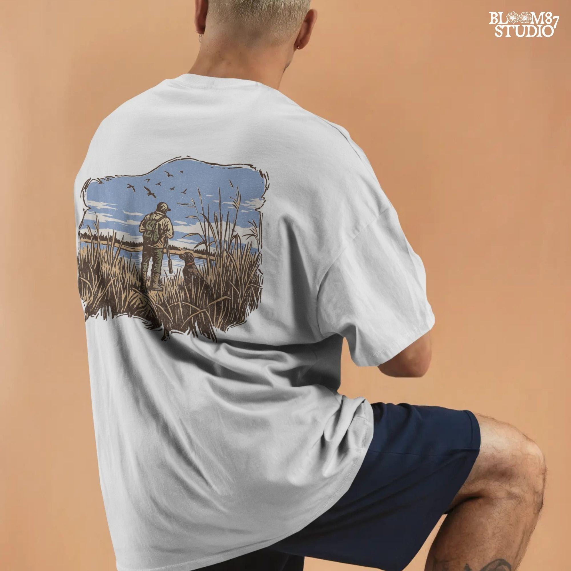 Rustic illustration of a duck hunter with shotgun standing beside his dog in a marsh, watching ducks fly overhead under a blue sky