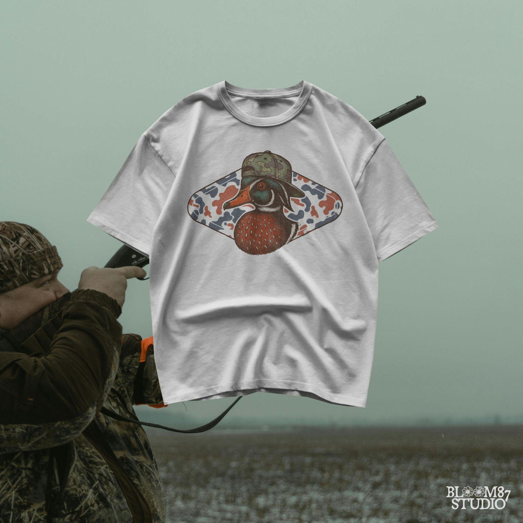 Funny wood duck in camo hat with red white blue camo background – patriotic sublimation design for hunters.