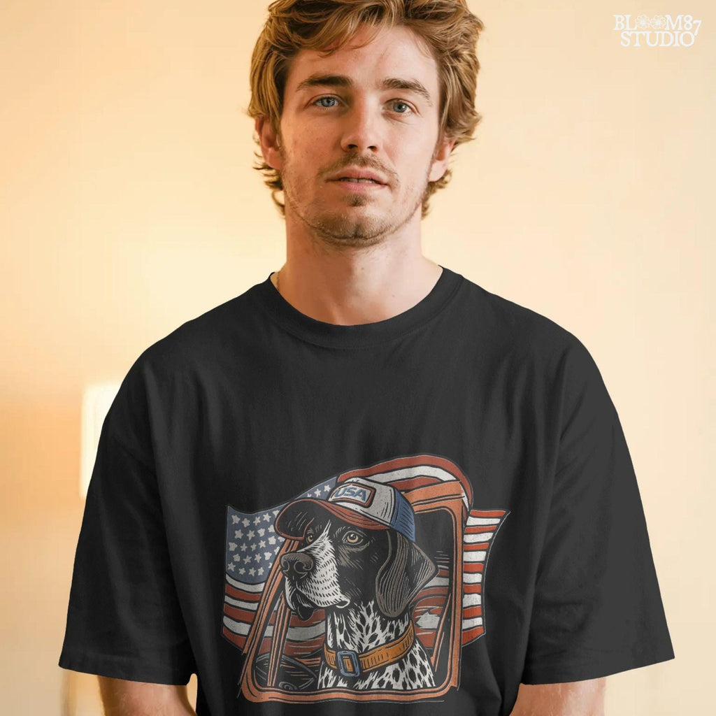 German Shorthaired Pointer dog wearing USA hat looking out of truck window with American flag waving in background