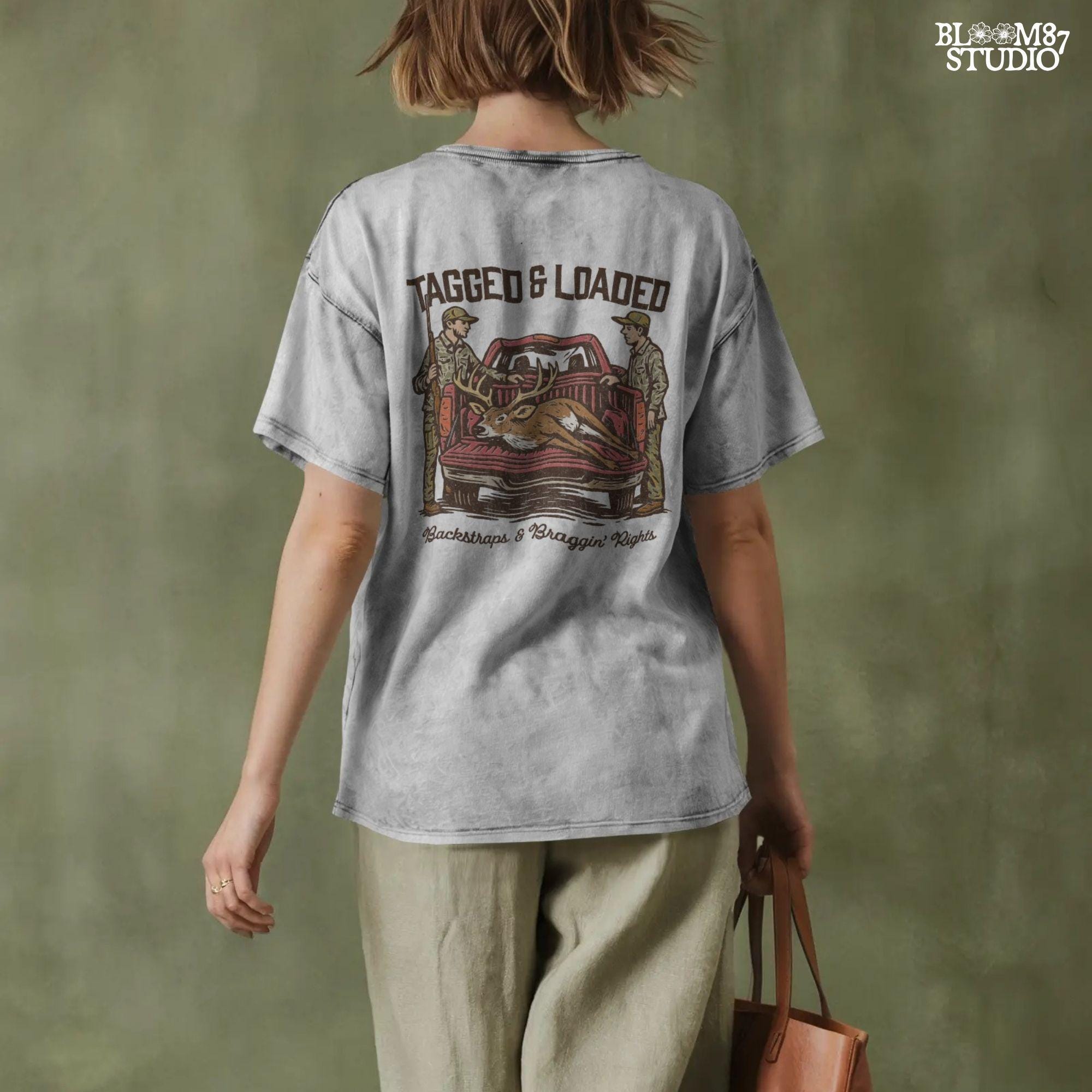 Rustic hunting design with two hunters, a truck, and a buck in the bed. Tagged and Loaded quote for deer season and outdoor graphics.