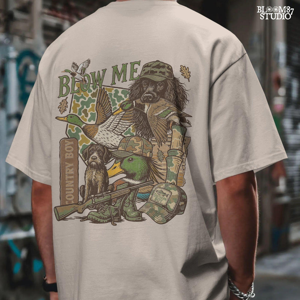 Retro collage of duck hunting elements including mallards, camo, duck dog, country boy rifle, and “Blow Me” southern humor quote.